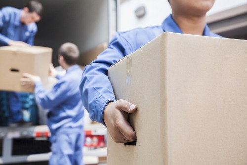 Removal van and moving team in a Notting Hill residential street
