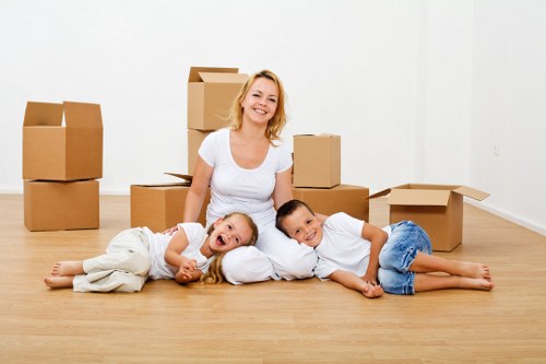 Moving team unloading household items at a Notting Hill property