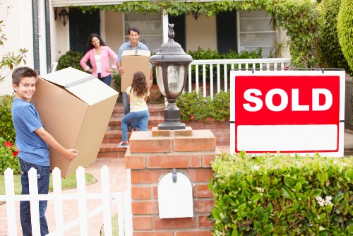 Packed moving boxes and furniture ready for transport in a Notting Hill flat